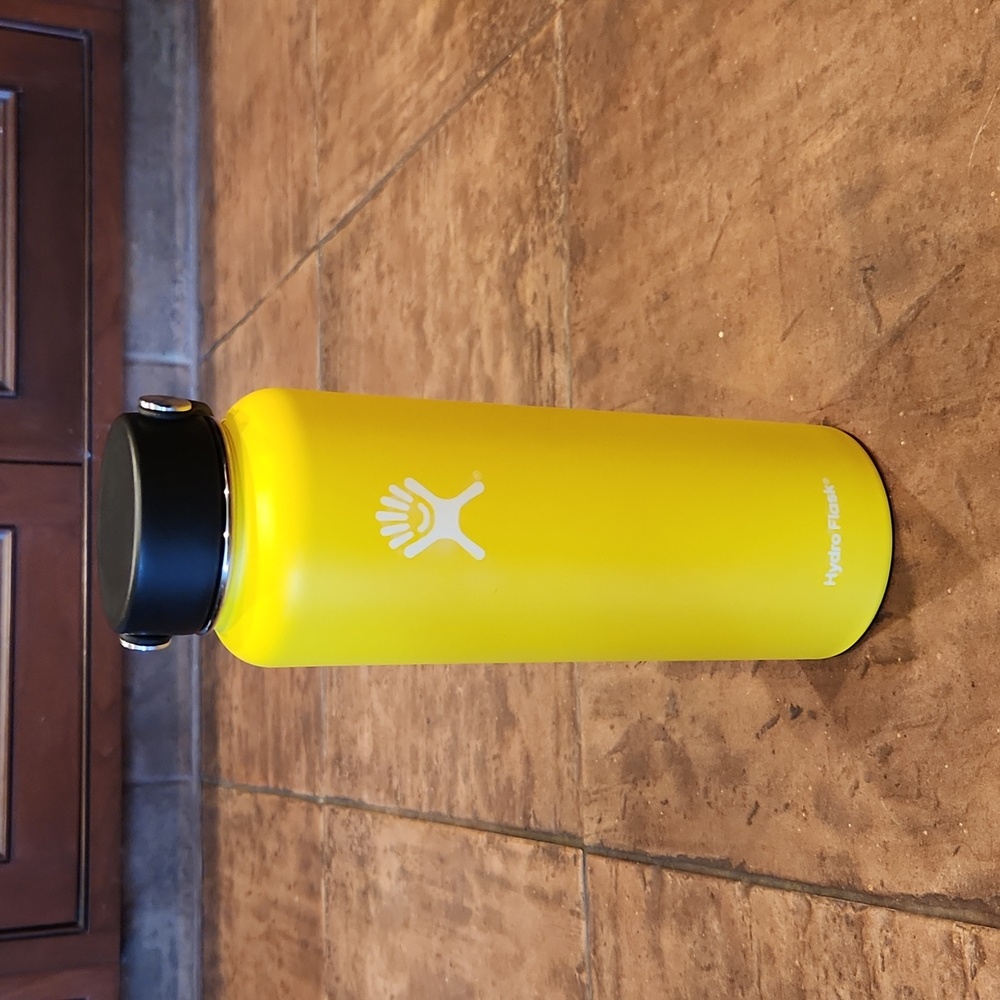 Yellow 40 oz. Hydro Flask w/ Turquoise Silicone Protective Sleeve.